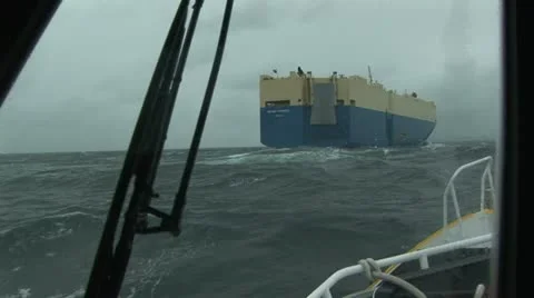 Pilot boat navigating close to cargo ship on Columbia River Oregon, USA Stock Footage 22411018