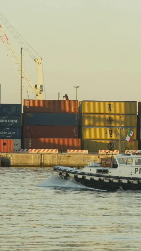 Pilot boat near container ship in Genoa port, vertical, Italy. May 23, 2026 Видео 335634751