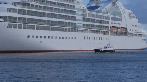 Pilot boat next to cruise ship Stock Footage 32516632