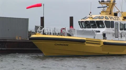 PILOT BOAT NEXT TO DOCK Stock Footage 55773118
