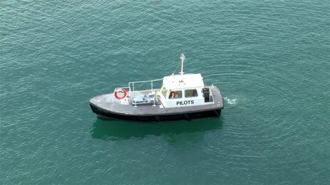 Pilot boat pulls alongside a cruise ship. Video stock 146078716
