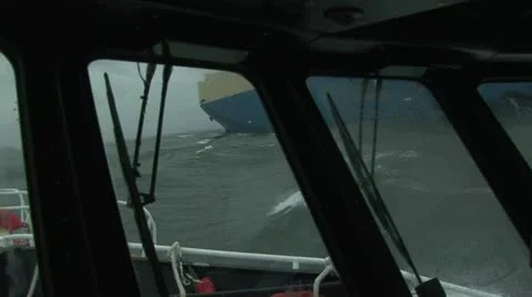 Pilot boat side to side with cargo ship on the Columbia River, Oregon USA Stock Footage 22411191