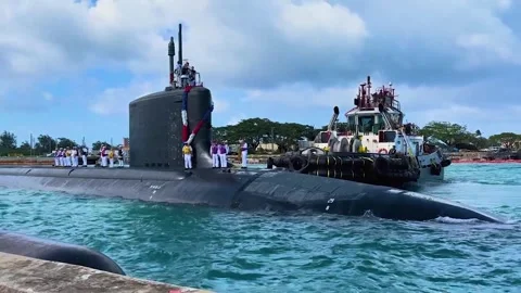 Pilot boat steering U.S. Navy submarine USS Minnesota SSN 783 at Naval Base Guam Stock Footage 293567541