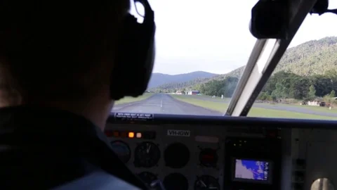 Pilot bringing small airplane up in the air Stock Footage 71354944