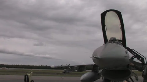 Pilot checking fighter jet at Red Flag Alaska Stock Footage 32575603