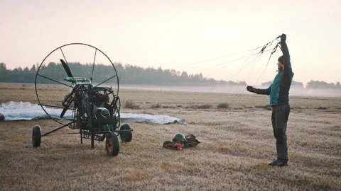 Pilot checking parachute cords, pre-flight procedure Video stock 152950527