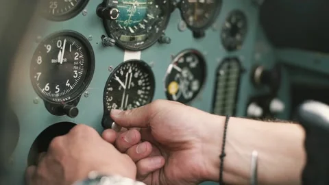 The pilot checks the instruments on the plane Stock-Footage 147715681