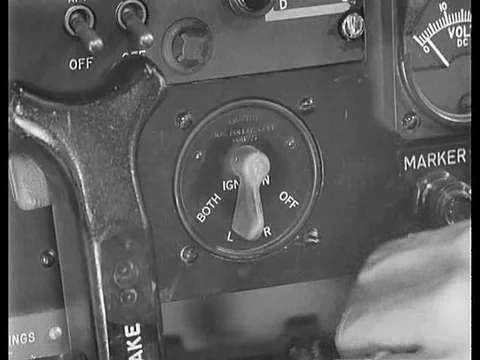 A pilot checks the workings of the h-19 helicopter after the engine has been Video stock 75199694