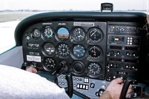 Pilot cheks the instruments in the airplane Stock Photos