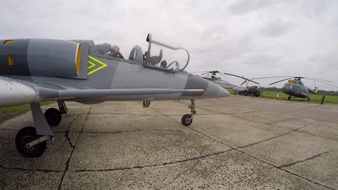 Pilot close cockpit. Crew of gray training aircraft is ready for take-off. Stock Footage 118676323