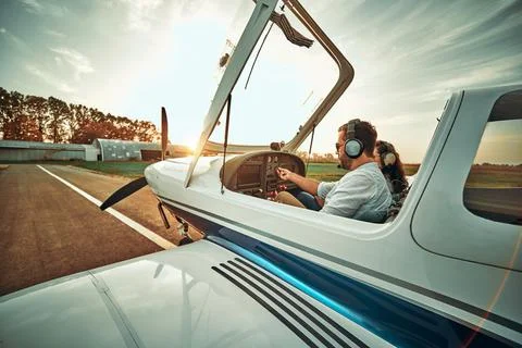 Pilot with co-pilot prepare take off in a small aircraft Stock Photos