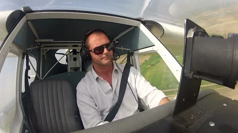 Pilot in the cockpit of airplane Stock Footage 32617714
