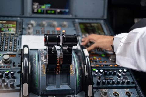 Pilot in command setting control panel in cockpit Stock Photos