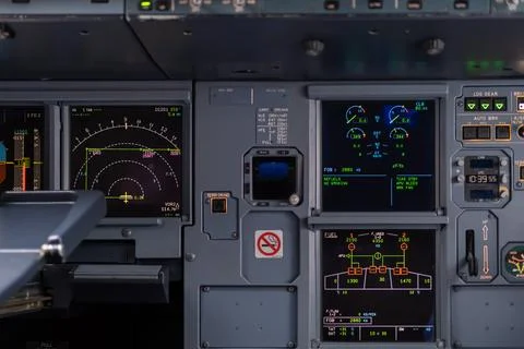 Pilot in command setting control panel in cockpit Stock Photos