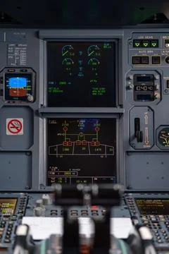 Pilot in command setting control panel in cockpit Stock Photos