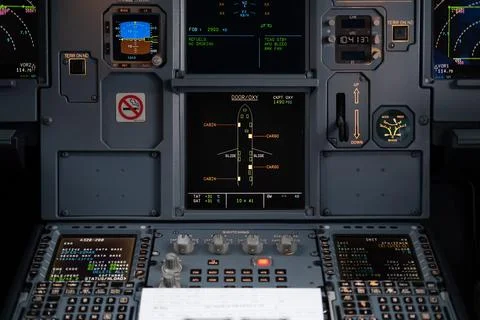 Pilot in command setting control panel in cockpit Stock Photos