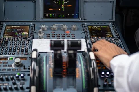 Pilot in command setting control panel in cockpit 스톡 사진