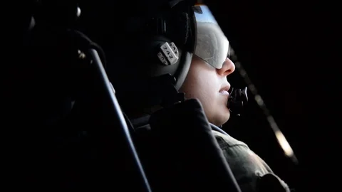 Pilot at control and USAF Pararescue Airman in airplane for training - 2018 Stock Footage 106038582