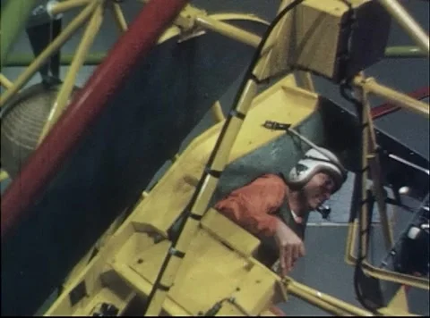Pilot controlling Multi-Axis Space Test Facility during simulated flight Stock Footage 262445131