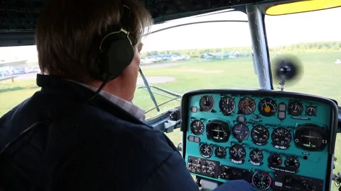 The pilot controls the airplane. Stock Footage 86490418