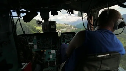 Pilot at the controls of a helicopter Stock Footage 73105121