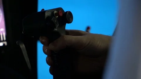 The pilot controls the helicopter by manipulating the lever Stock Footage 115784628