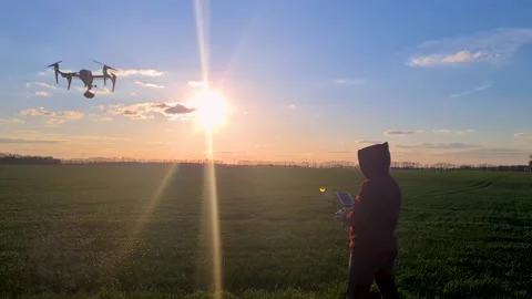 The pilot controls a professional drone Stock Footage 234005935