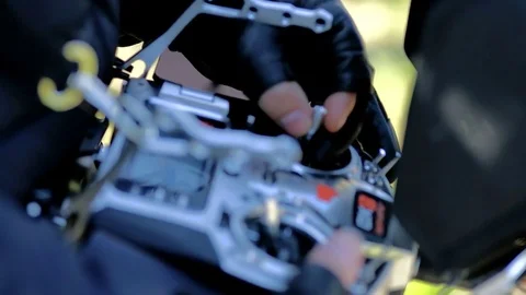 The pilot of the Copter finger controls the joysticks on the control panel. 스톡 동영상 75826319