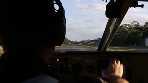 Pilot doing start up procedure on small airplane Stock Footage 71354964