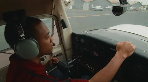Pilot driving plane on runway Stock Footage 60269124