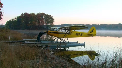 Pilot Early Morn Preflight Floatplane Turning Plane Video stock 74858768