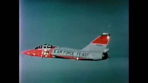 A pilot ejects from his plane and parachutes safely. Stock Footage 143851403