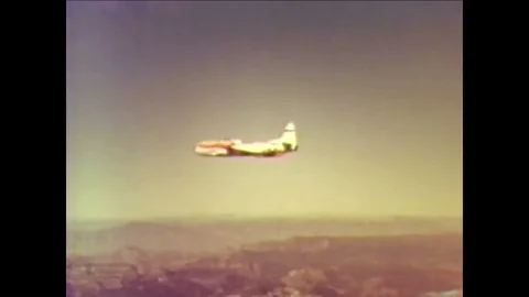 A pilot ejects from a Lockheed T-33 Shooting Star jet trainer aircraft and Stock Footage 93739416
