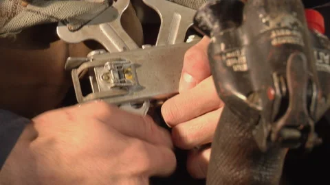 Pilot fastening clips on parachute Video stock 237697552