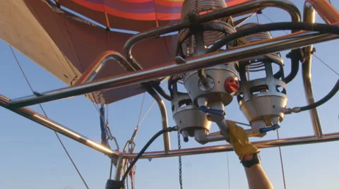 Pilot feeds flame to hot air balloon Stock Footage 59792849
