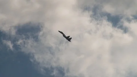 Pilot fighter Su-35  of fourth-generation performs maneuver at low speed. Stock Footage 107584658