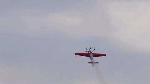A pilot flies an aerobatic propeller plane in the sky Stock Footage 315124693