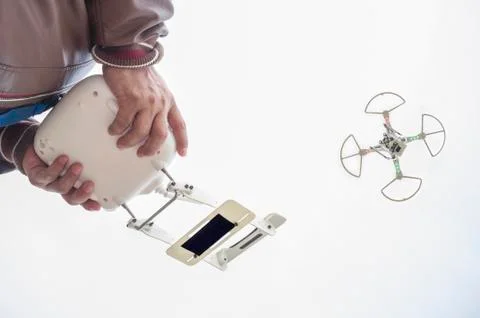 Pilot flying drone with FPV mount empty on remote controller Stock Photos