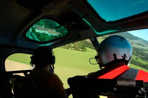 Pilot flying in a helicopter Stock Photos