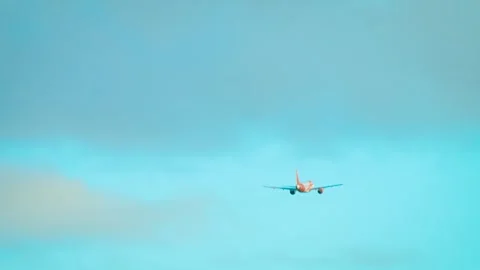Pilot flying passenger jet into cloudy blue sky. Aviator controlling airplane Stock Footage 326155771