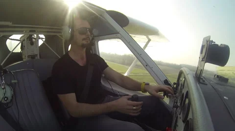 Pilot flying on small airplane Stock Footage 42480731