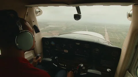 Pilot flying small plane over fields Video stock 60270404