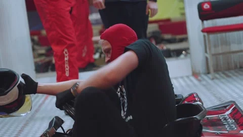 The pilot gets up from the go-kart Stock Footage 270537839