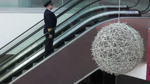 The pilot goes up the escalator Stock Footage 224026222