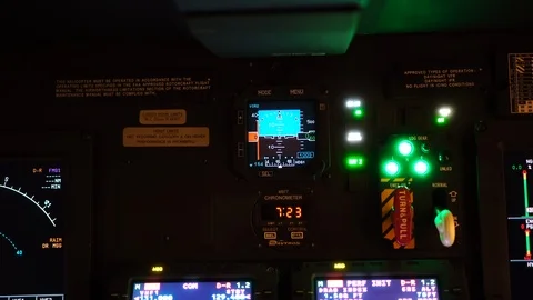 Pilot hand is adjusting electronic standby attitude indicator in cockpit Stock Footage