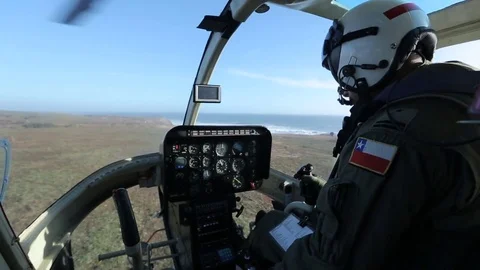 Pilot handling helicopter 스톡 동영상 77049757