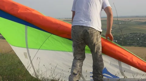 The pilot of hang glider preparing to fly Stock Footage 64591755
