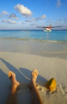 Pilot has a rest on a sandy beach, Maldives 写真素材