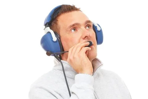 Pilot with headset looking aside Foto stock