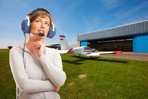 Pilot with headset outside Stock Photos